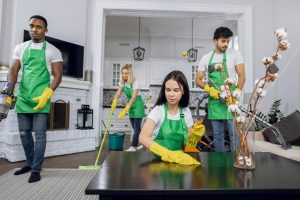 Group of multiracial people professional cleaning of room